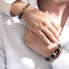 دستبند چرم زنانه با پلاک طلا طرح امگا کد XB612
